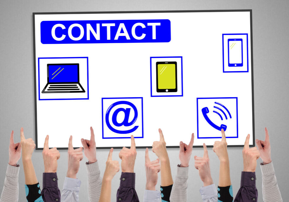 Contact concept on a whiteboard pointed by several fingers